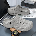 Men's black EVA slippers with thick sole, non-slip tread, and toe separator design on a white background.