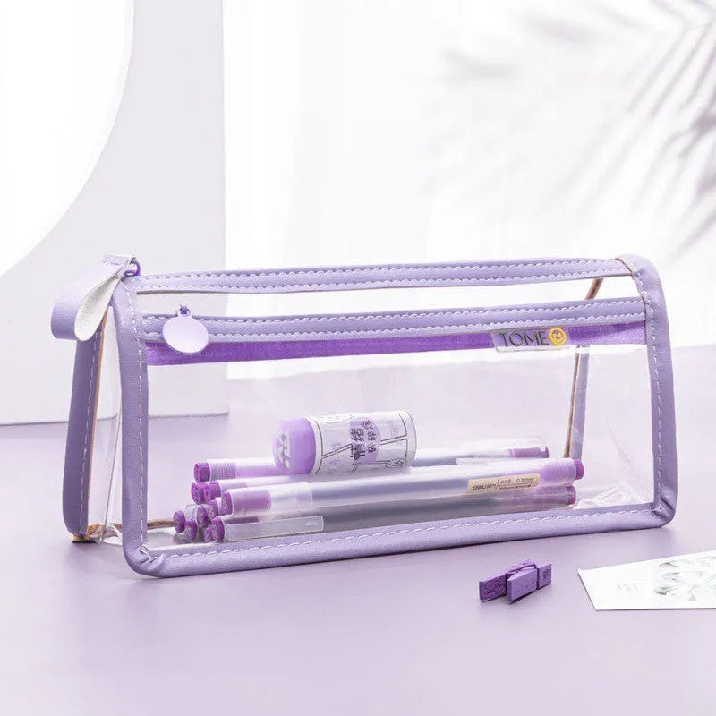 Large transparent double-layer pencil case in blue showing internal compartments, dimensions 220x110x80mm.