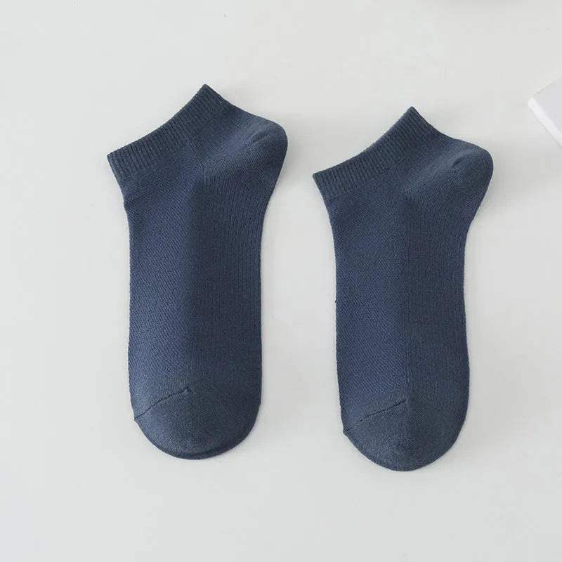 Men's low-cut solid colour boat socks made from breathable polyester, shown in one of six available colour options.