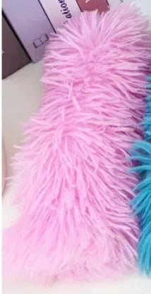 Green, white, blue, and pink plush cat toy pillow measuring 27 by 10 centimetres.