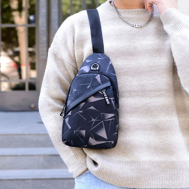 Blue Oxford cloth crossbody sling bag with earphone hole and zipper pocket.