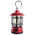 Dark green portable LED camping lantern and head lamp showing compact design and head strap.