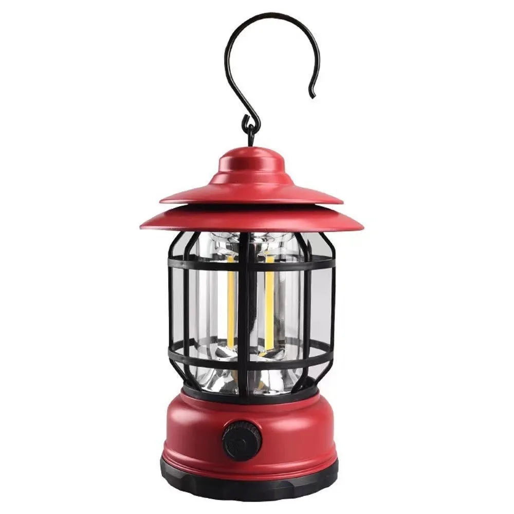 Dark green portable LED camping lantern and head lamp showing compact design and head strap.