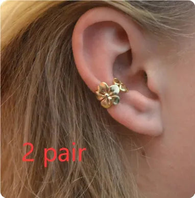 Gold electroplated starfish and conch shell drop earrings with beach style design