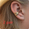 Gold electroplated starfish and conch shell drop earrings with beach style design