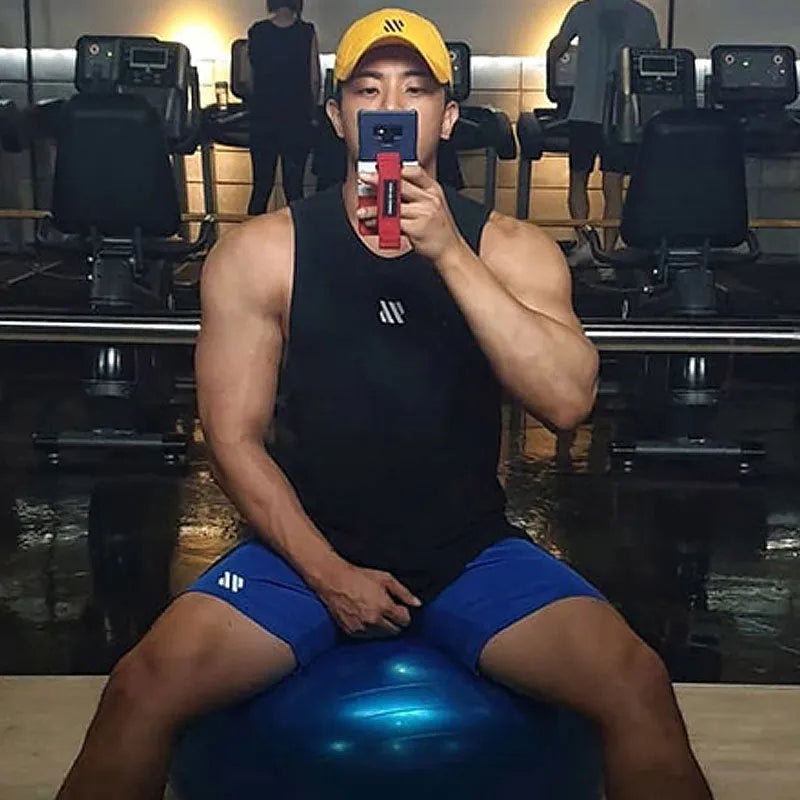 Men's loose black metal silk polyester sports shorts for running, laid flat.