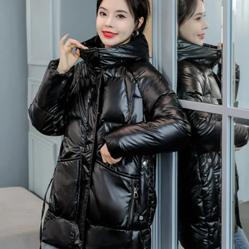Women's loose thick winter hooded jacket in black colour with long sleeves