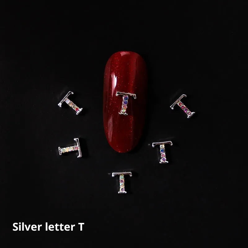 Gold alloy letter A nail ornament charm with crystal detail on a square chain base