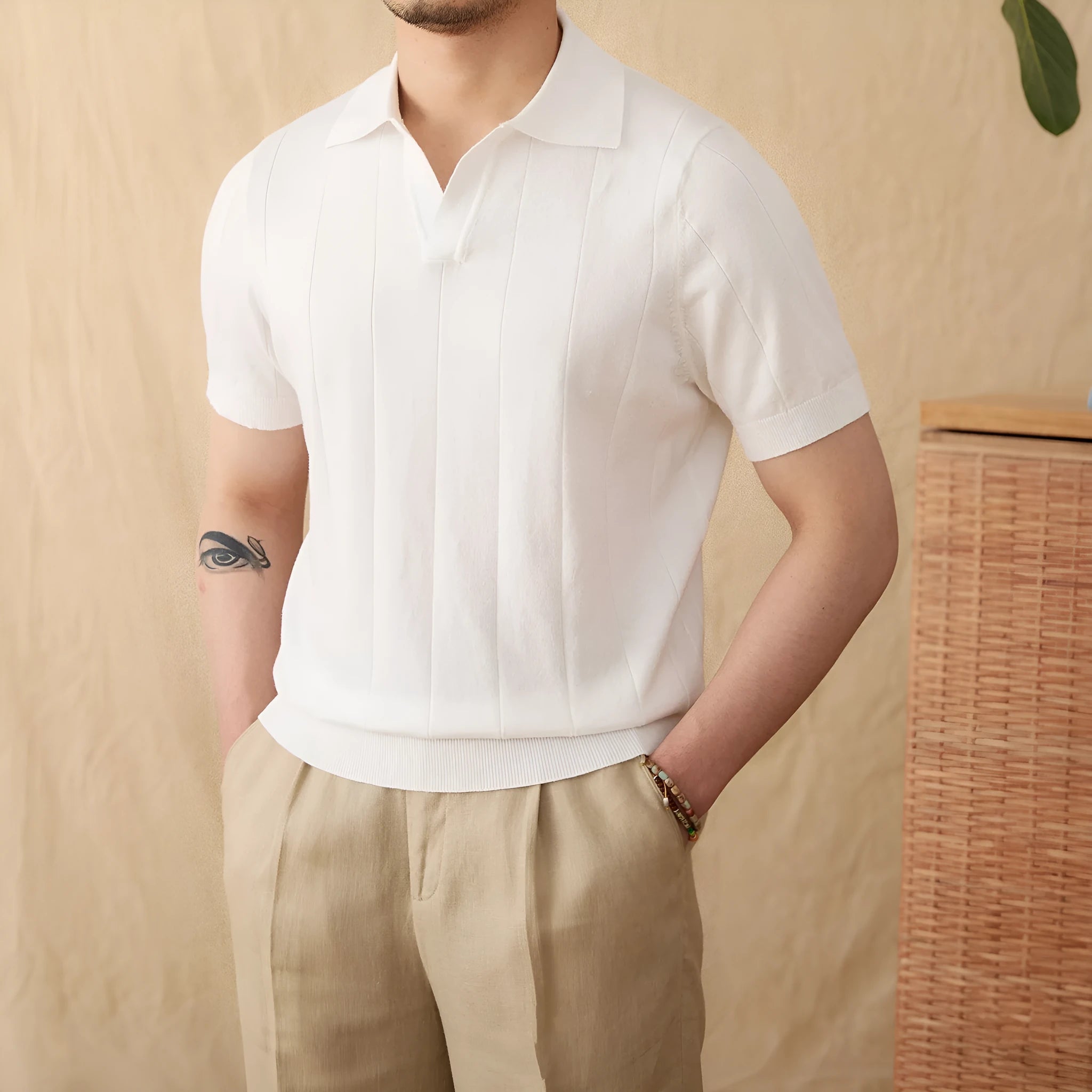 Purple cotton and linen knitted polo top with short sleeves, a seagull collar, and a sunken stripe pattern.