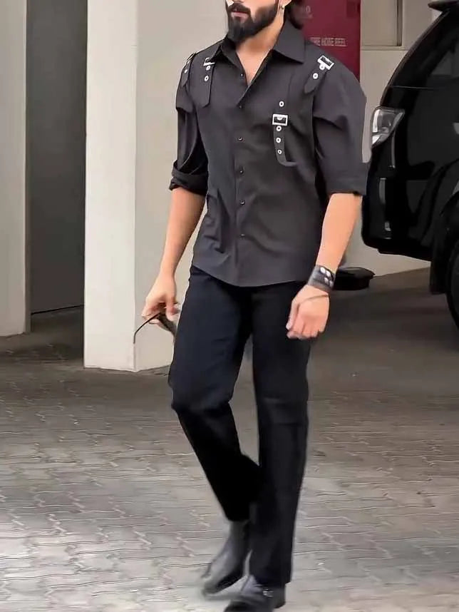 Man wearing a black regular-fit polyester button-up shirt for casual daily wear.