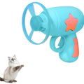 Blue plastic cat toy gun launcher with a mounted orange Frisbee, shown next to a second green Frisbee.