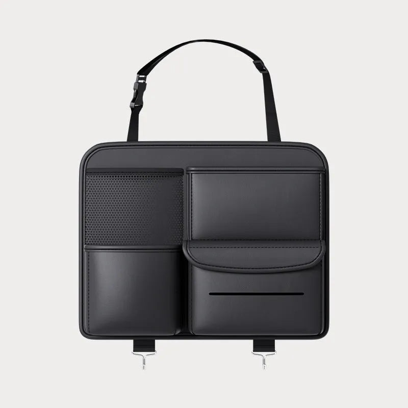Black leather car seat back hanging storage organiser bag with handle shown mounted on a headrest.