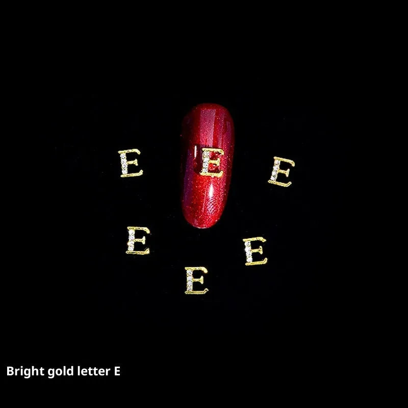 Gold alloy letter A nail ornament charm with crystal detail on a square chain base