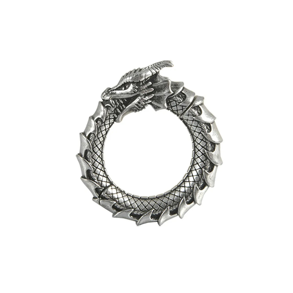 A pair of large antique silver alloy earrings featuring a hollow out geometric dragon design.