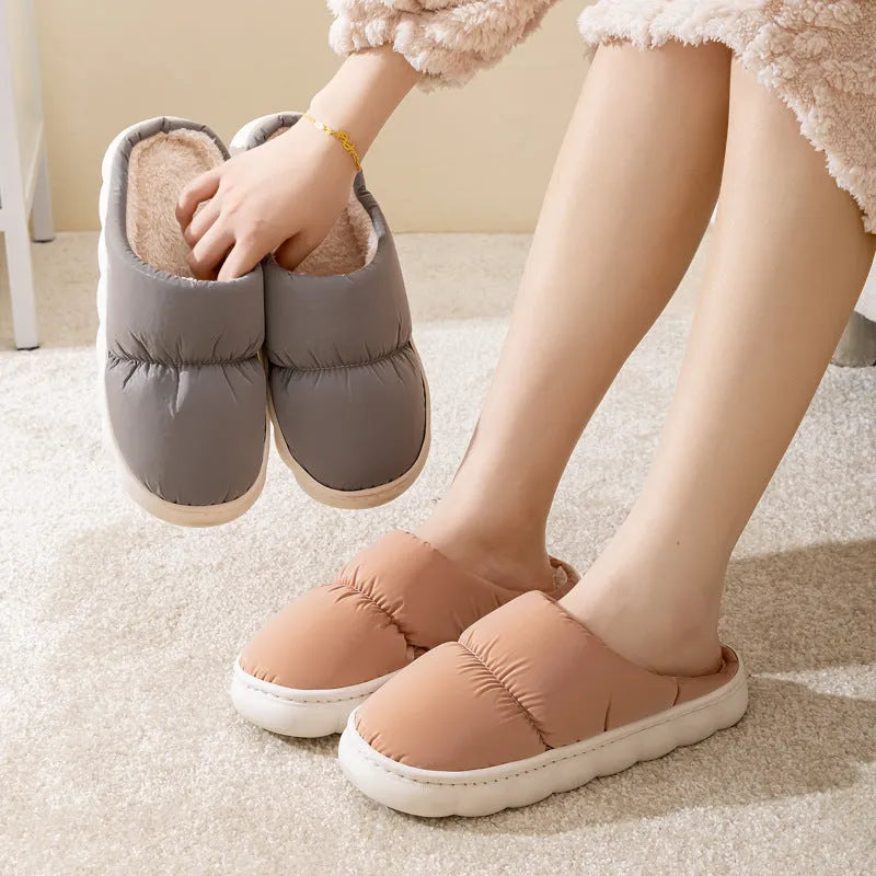 Down cotton winter slippers with artificial leather upper, thick rubber sole, and plush lining in blue colour