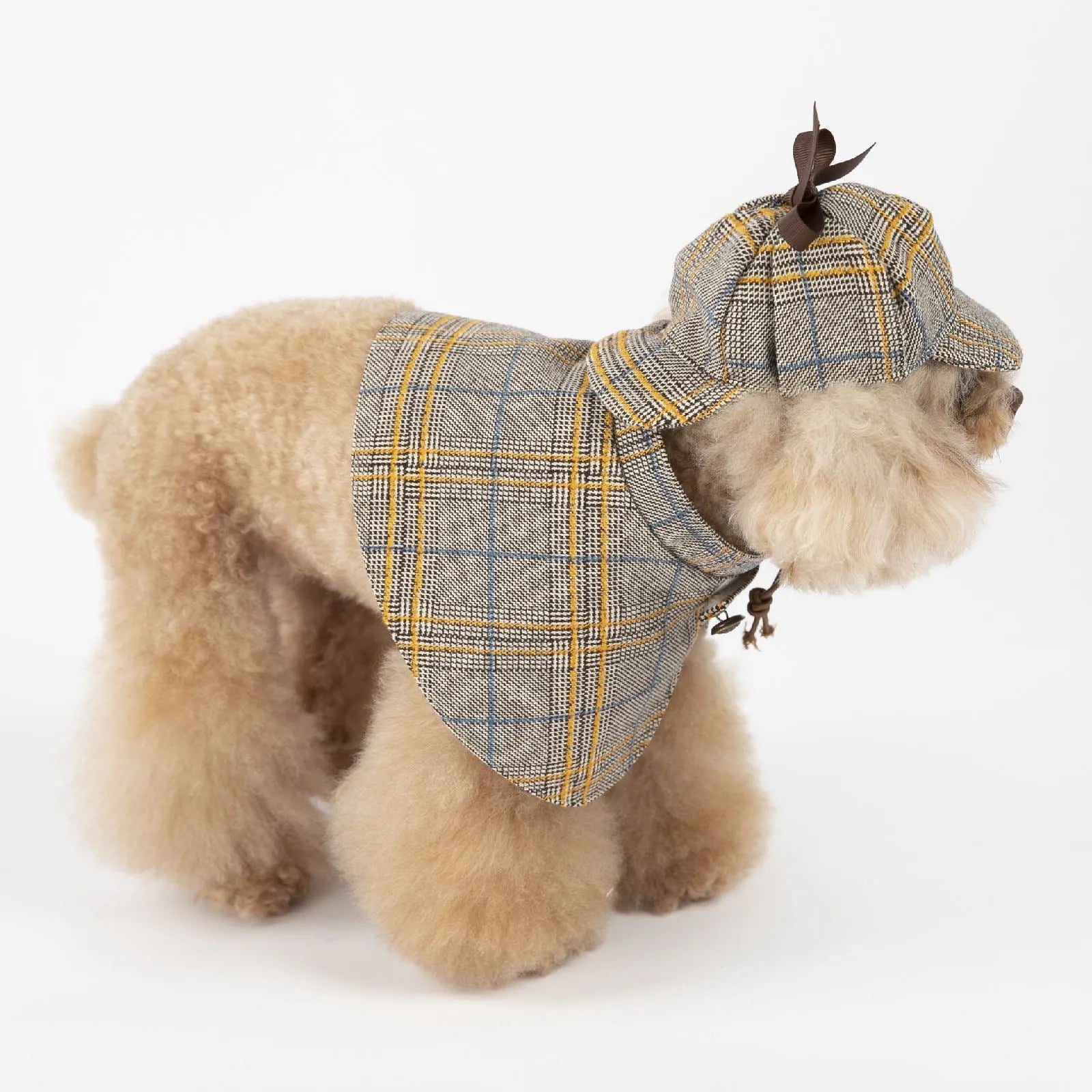 Camel-colour cotton detective cloak pet costume with adjustable hat on a small dog
