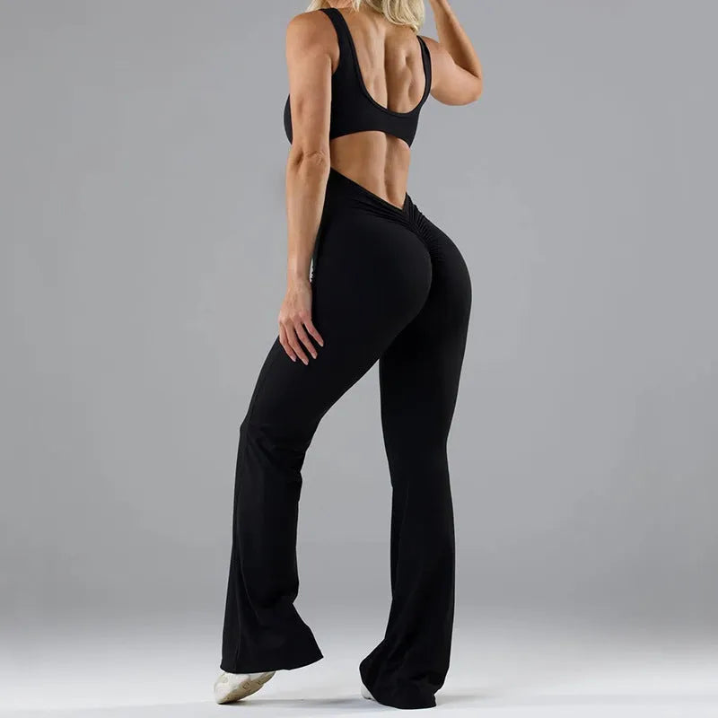 Black women's tight seamless yoga bodysuit with a mid waist and trousers length.