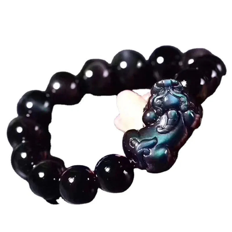 Natural obsidian eye crystal bracelet showing characteristic patterning on beads