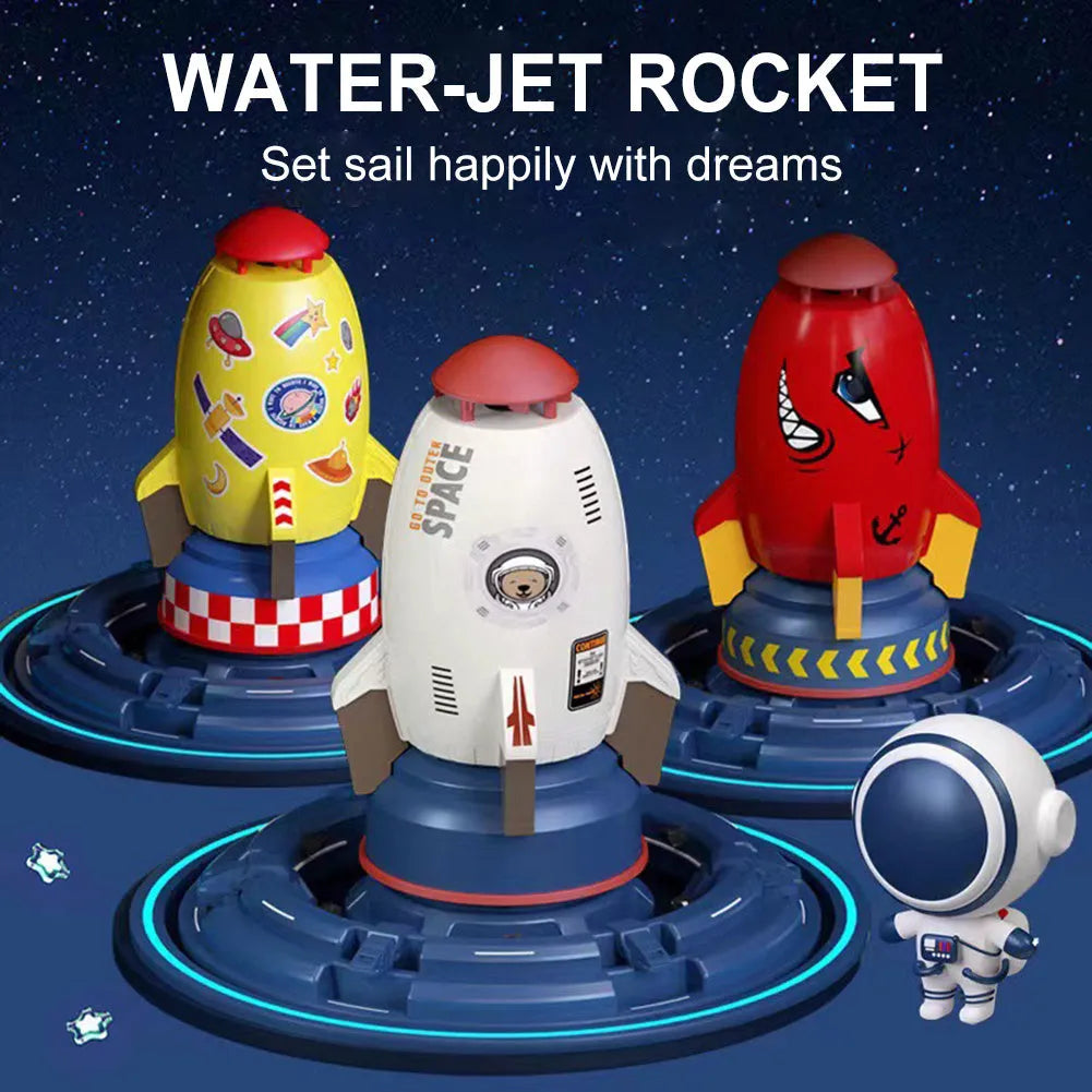 Water pressure rocket launcher toy on green grass with water spray, yellow rocket, and base connector