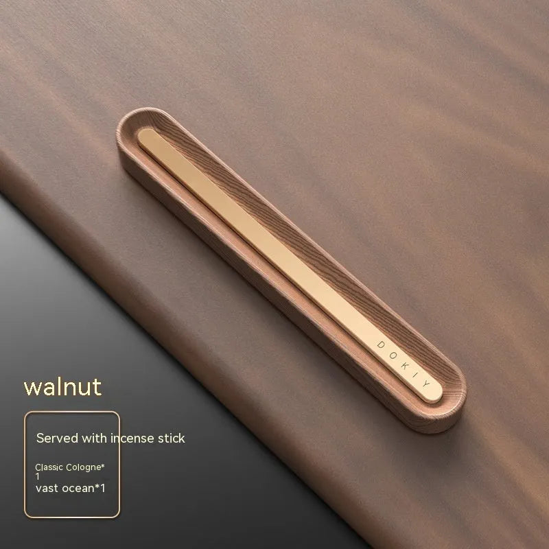 Solid long strip car aromatherapy ornament clipped to a car air vent, in walnut wood finish.