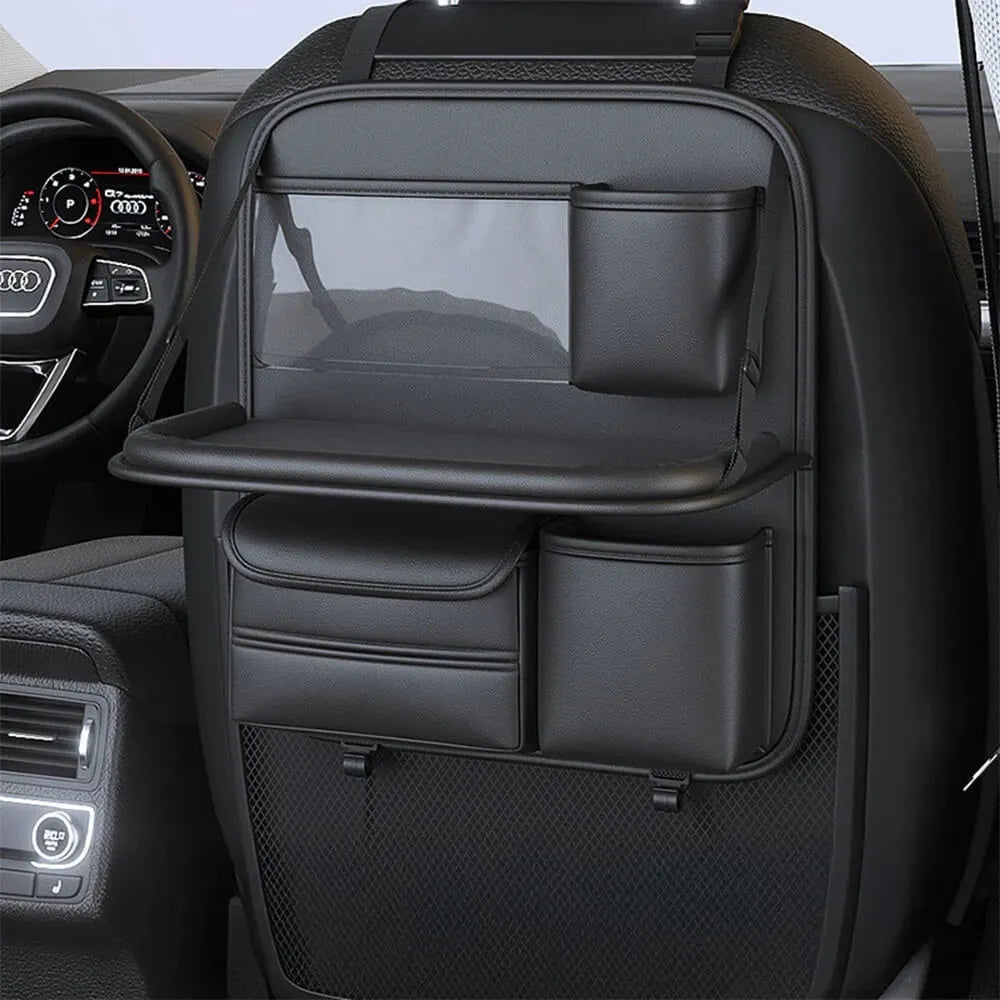 Car seat lazyback storage bag in Obsidian Black with foldable dining table extended, hanging on a car front seat backrest