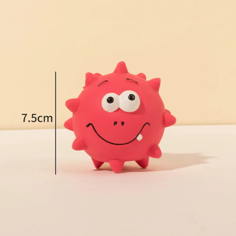 Set of four colourful latex squeaky dog balls with cute faces on bumpy textured surfaces