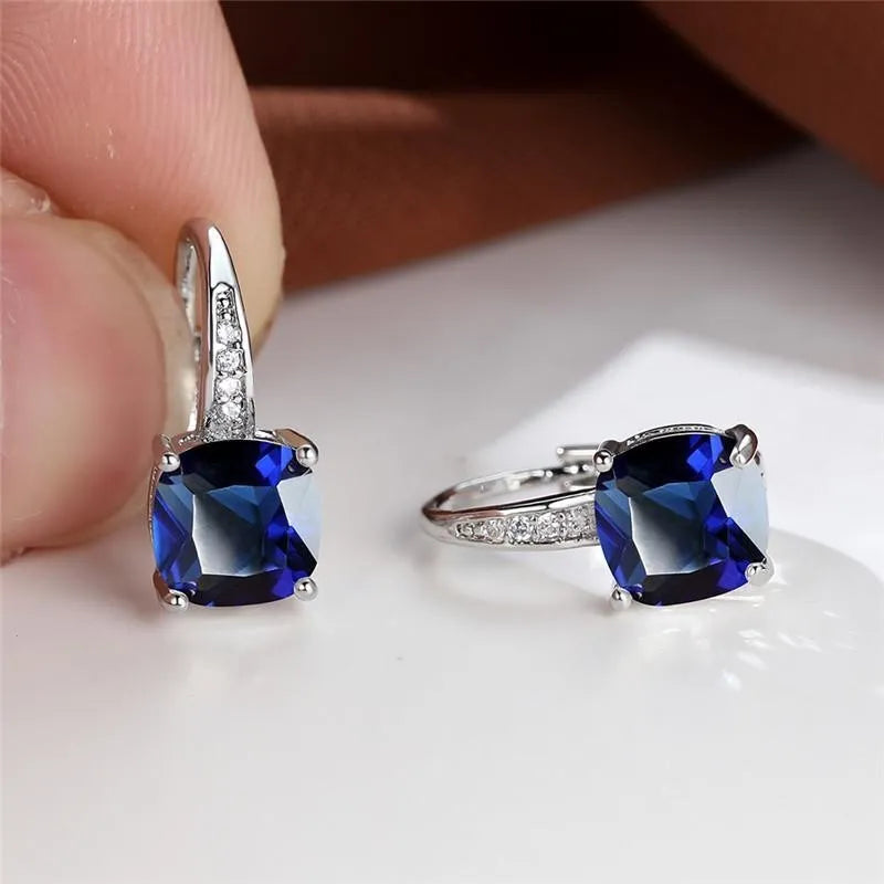 Square geometric ear hook studs with a round zircon stone, shown in a gold electroplated finish.