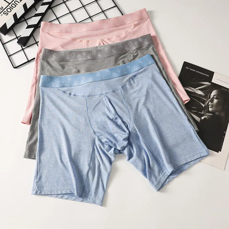 Men's lengthened modal ice silk boxer shorts with hip lifting in blue, front view