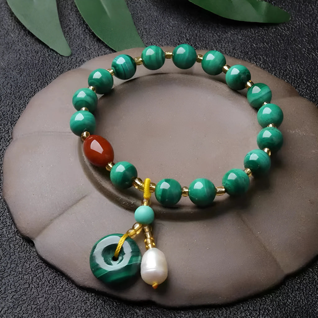Natural malachite bracelet with southern red agate barrel beads showing green and red stone details