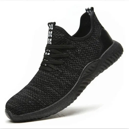 Black steel toe cap safety shoes with anti-static properties and EVA construction on a work floor.