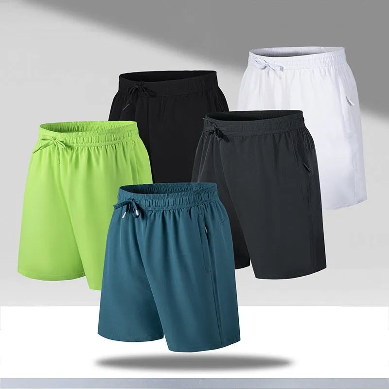 Man wearing loose-fit black quick-drying polyester beach shorts with a micro-elastic waistband.