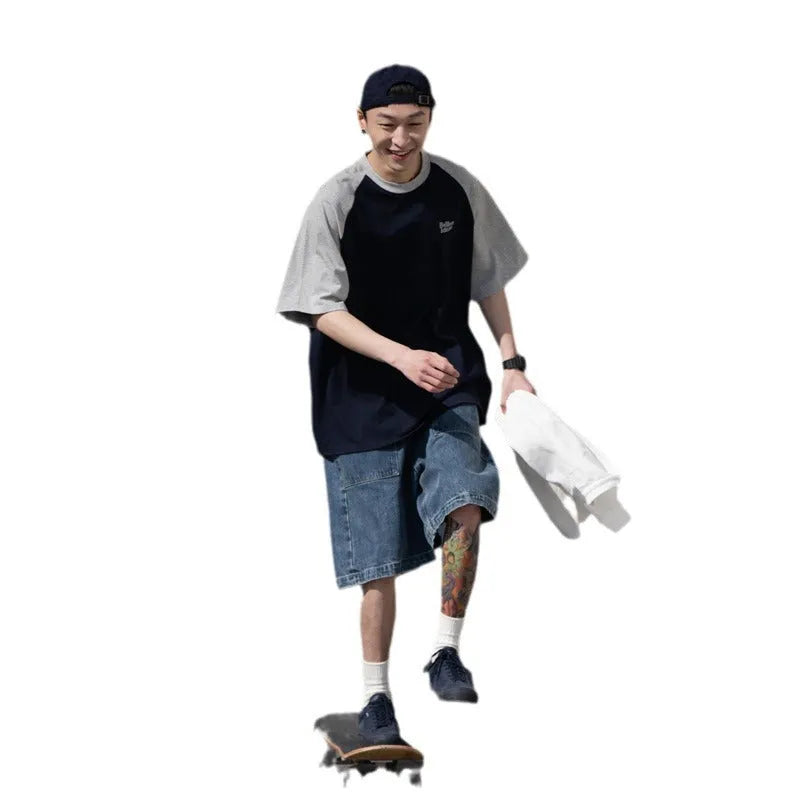 Blue loose-fit men's raglan sleeve T-shirt on a hanger, front view.