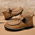Men's black casual slip-on shoes with handmade stitching on the synthetic leather upper and a flat sole.