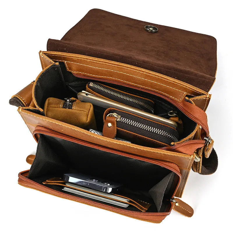 Men's dark brown Crazy Horse leather crossbody bag with visible stitching, shown holding A4 documents.