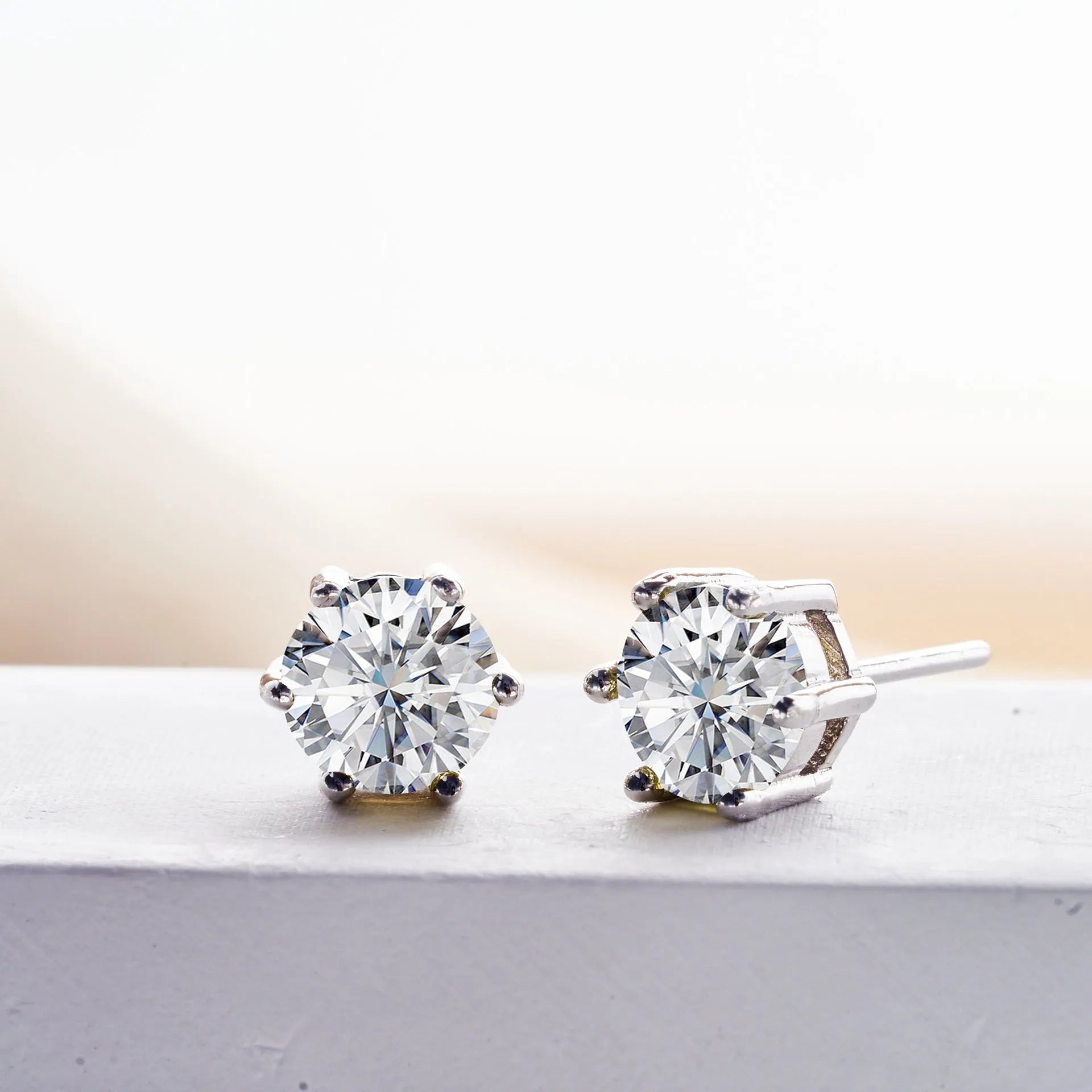 Micro inlaid moissanite stud earrings in S925 sterling silver with round natural stones, unisex design, 1CT per pair