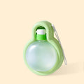 Green portable dog water bottle with pull-out drinking bowl for outdoor travel and camping.