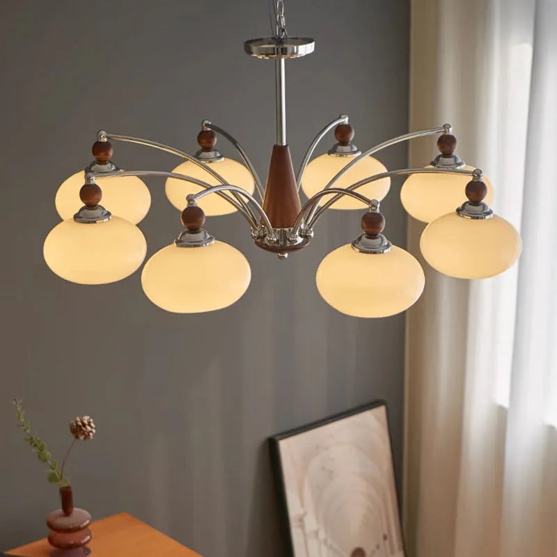 Creative persimmon glass chandelier with chrome frame and multiple glass shades in milky white or cream yellow.