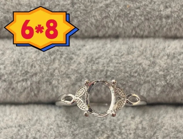 Open-mouth oval denier ring with a 6x8mm stone and five-pointed star decoration on a copper band.