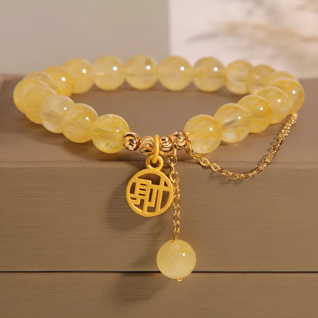 Natural citrine stone bracelet with an electroplated Chinese character tassel charm.