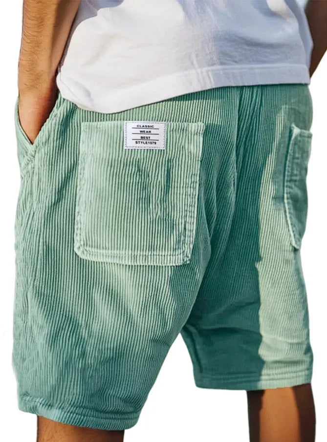 Men's grey straight-leg corduroy shorts with multiple pockets and embroidery detail on a hanger.