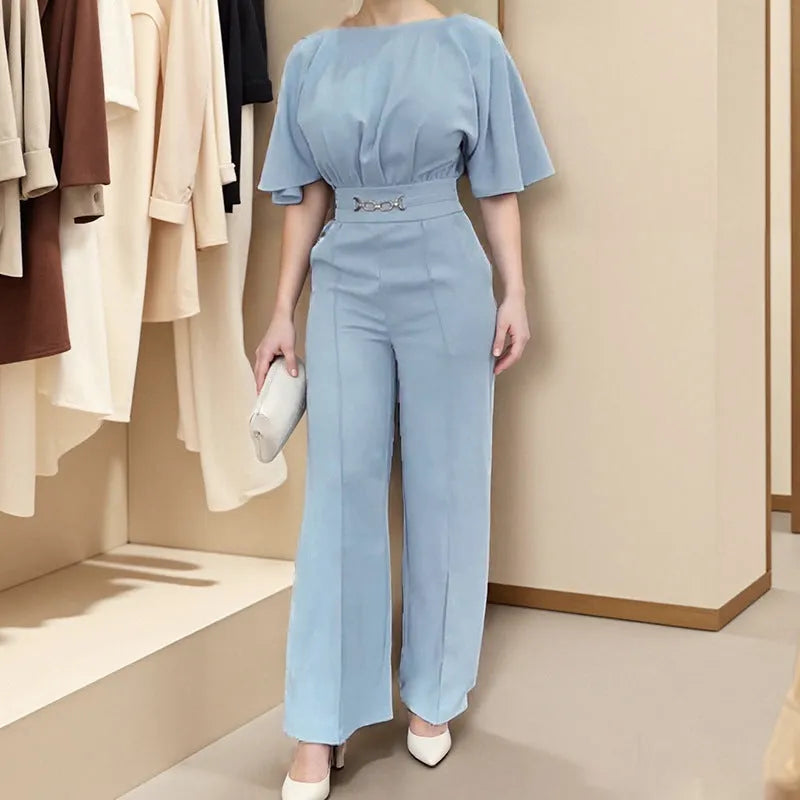 Blue polyester men's suit comprising trousers and a long-sleeve shirt, laid flat.