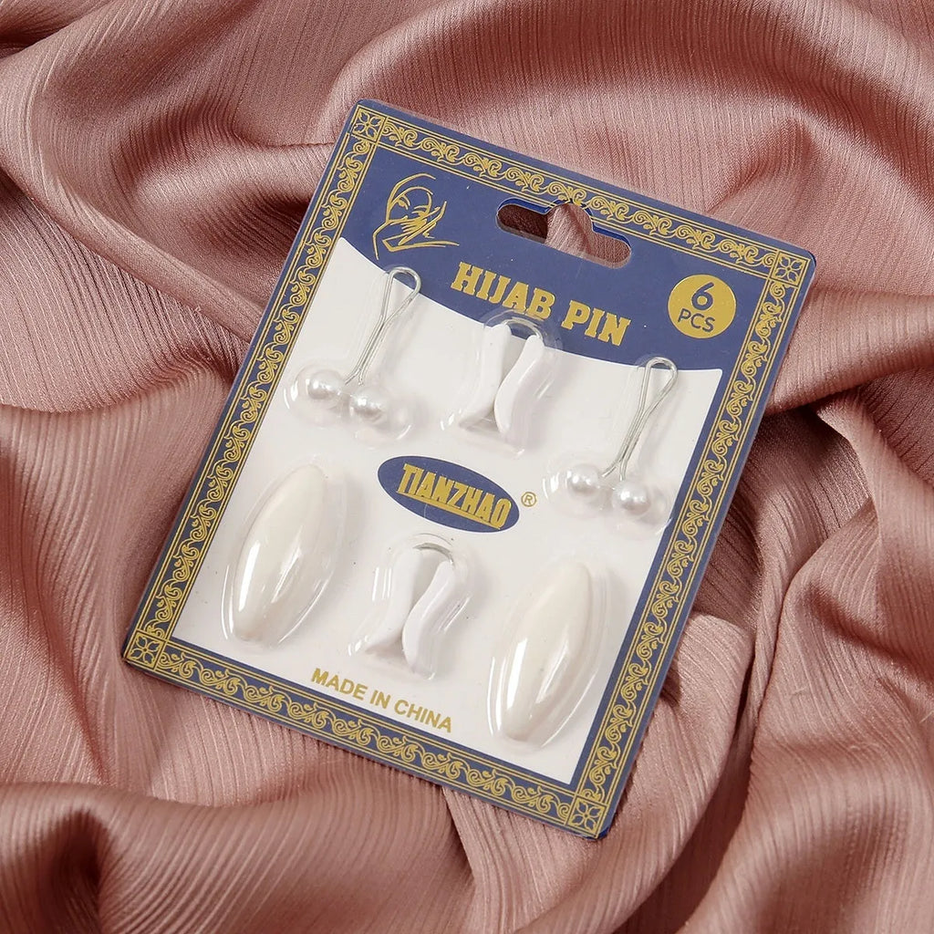 Plastic scarf clip with oval meander pattern and resin drip finish in five colours including black, gray, white, brown, and pink.