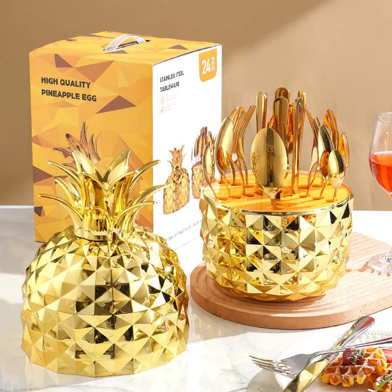 Fashion stainless steel 24-piece tableware set with mirror polish and pineapple egg design in gold finish on a dining table