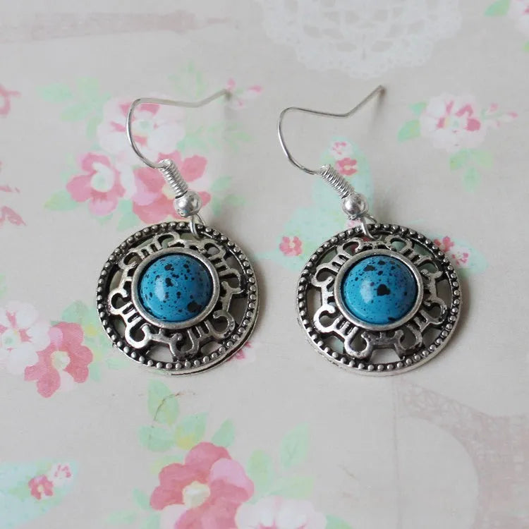 Geometric ethnic earrings with Tibetan silver and turquoise stones in traditional Miao style