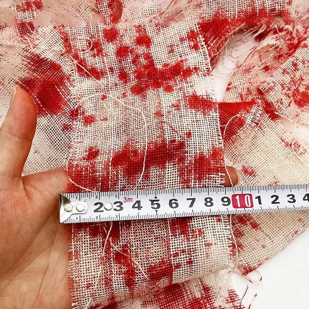 Roll of polyester Halloween horror bandage in bloody cloth red colour, 8cm wide