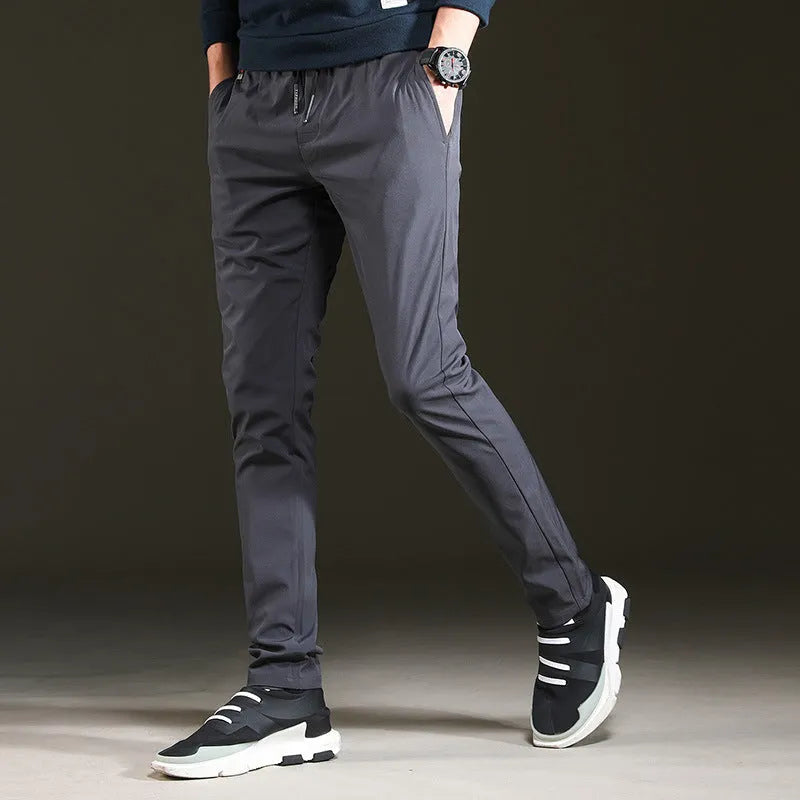 Men's slim cropped sweatpants in black with elasticated waist and relaxed fit, available in multiple sizes up to 5XL