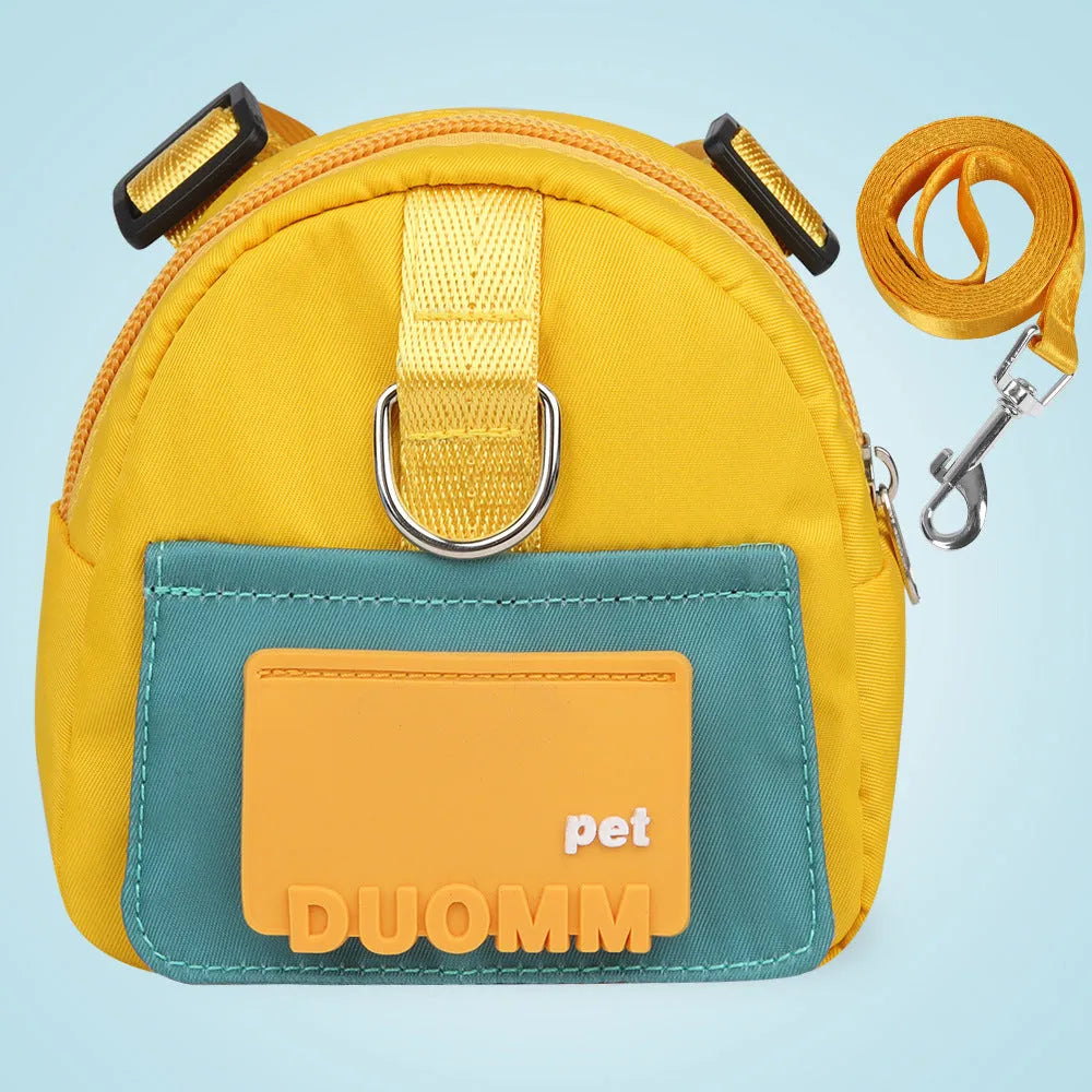 Blue adjustable dog backpack harness with storage compartment and a tow rope laid flat