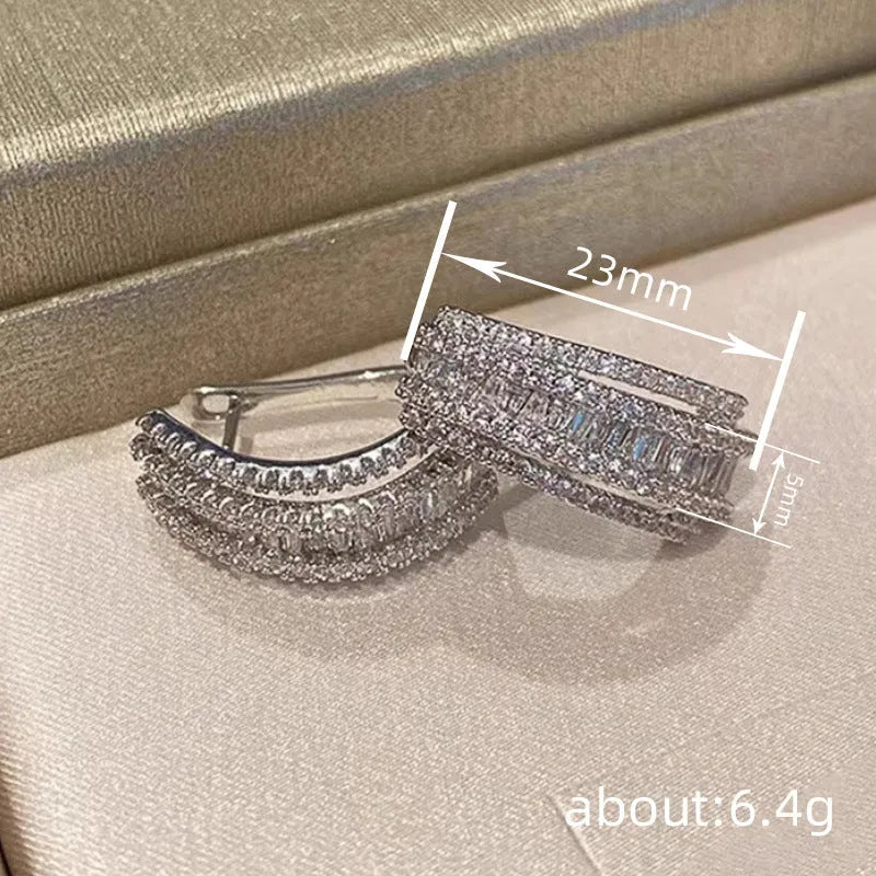 Geometric stud earrings with inlaid zircon stones in white gold colour