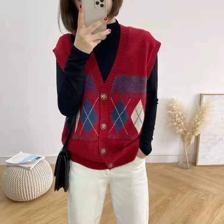 Khaki diamond plaid sleeveless cardigan top laid flat, showing loose fit and sleeveless armholes.