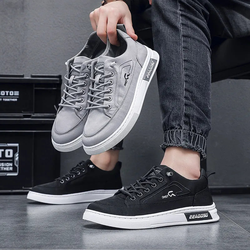 Grey men's canvas casual shoes with leather lining and rubber sole showing stitching details